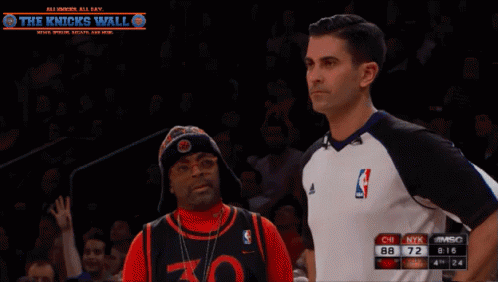 Man in 30 Jersey Beside Referee Knicks Wall