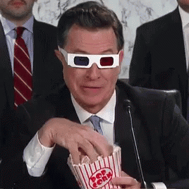 Man in 3D Glasses Eating Popcorn