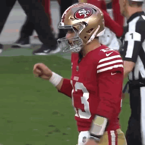 Man in 49ers Jersey and Helmet on Field