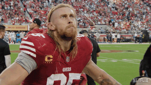 Man in 49ers Jersey on Football Field