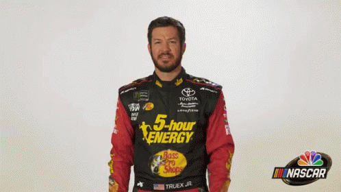 Man in 5 Hour Energy Shirt in Front of Nascar Logo