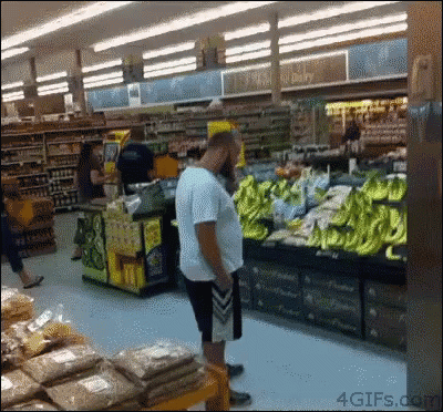 Man In A Banana Costume Drop Kick On Supermarket GIF