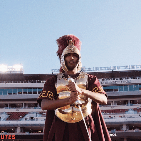 Man In A Trojans Costume Sword Attack GIF