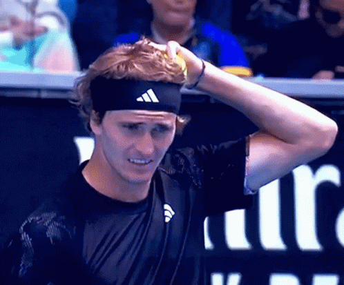 Man in Adidas Headband Holding Tennis Ball