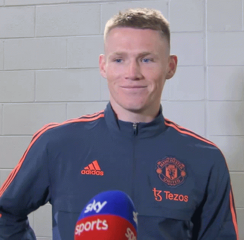 Man in Adidas Jacket with Sky Sports Microphone