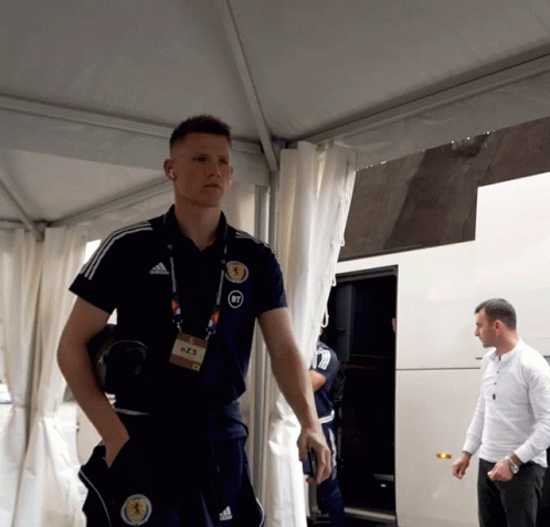 Man in Adidas Shirt With Scotland Badge