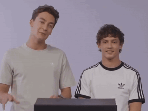 Man in Adidas T-Shirt Pointing