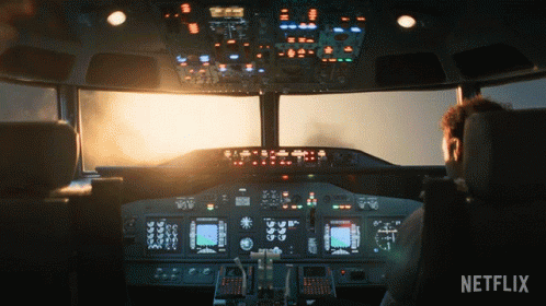 Man In Airplane Cockpit With Netflix Logo GIF