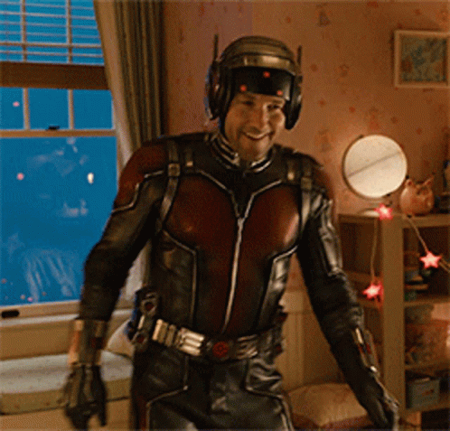 Man in Ant-Man Costume Standing in Room