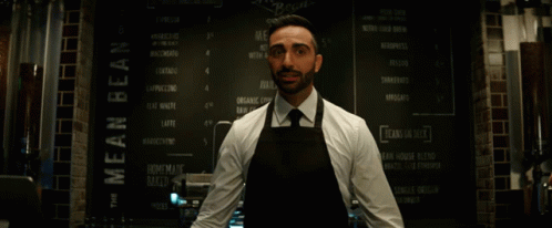 Man In Apron At Mean Bean Menu GIF
