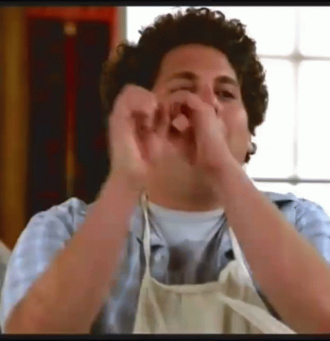 Man in Apron Making Heart Shape