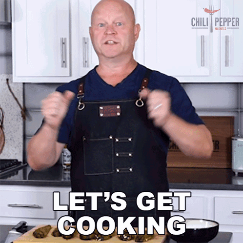 Man In Apron Saying Lets Get Cooking GIF