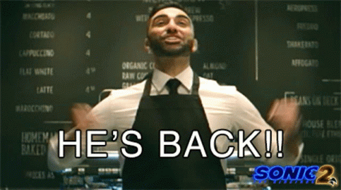 Man In Apron Says He's Back At Menu Board GIF