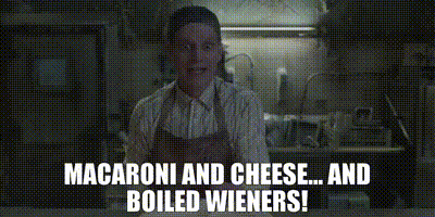Man in Apron Talking About Macaroni and Cheese