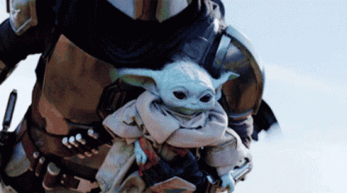 Man in Armor Carrying Baby Yoda