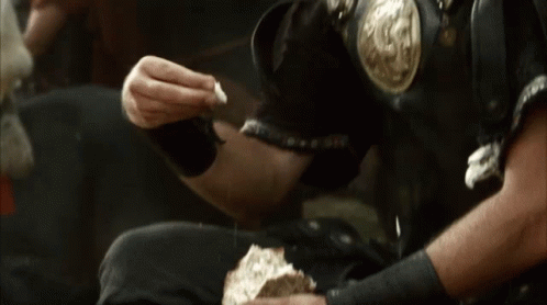Man in Armor Eating Bread