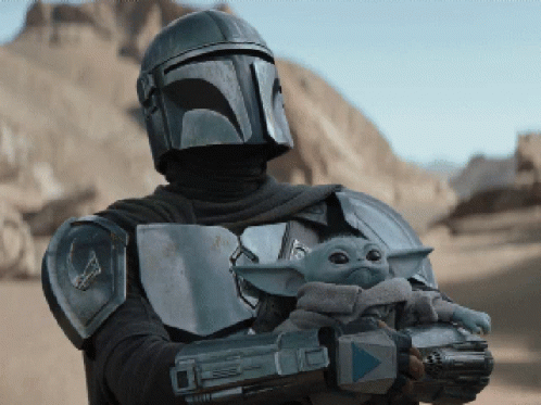 Man In Armor Holding Baby And Gun GIF