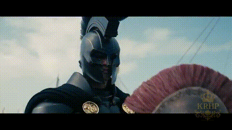 Man In Armor Holding Red Feathered Helmet GIF