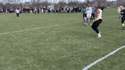 Man In Armor Holding Shield And Axe On Sidewalk GIF