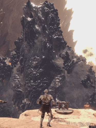 Man in Armor Standing Before Large Rock Formation
