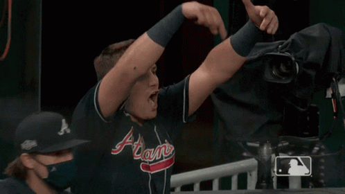 Man in Atlanta Braves Jersey Giving Thumbs Up