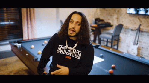 Man In Atlanta Sweatshirt By Pool Table GIF