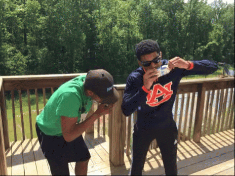 Man In Auburn Sweatshirt Drinking From Bottle GIF
