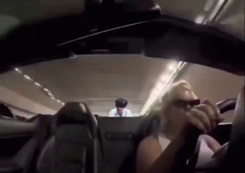Man in Back Seat of Airplane Woman in Front