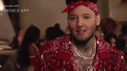 Man in Bandana and Red Shirt With Group