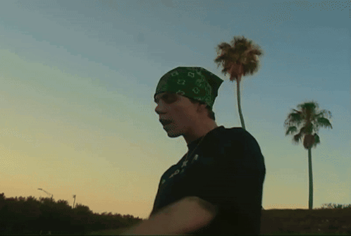 Man in Bandana and T-Shirt Saying A