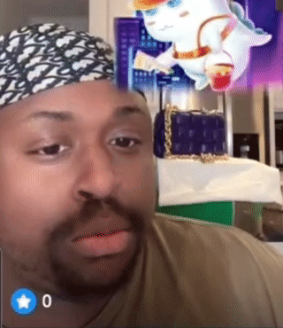 Man in Bandana Looking at Camera With Blue Star