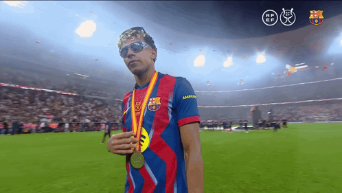 Man in Barcelona Shirt Holding Medal
