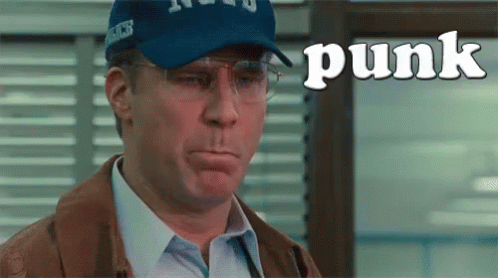 Man In Baseball Cap And Glasses Making Funny Face With Punk GIF