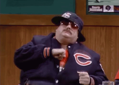 Man in Baseball Cap and Sunglasses Holding Bat