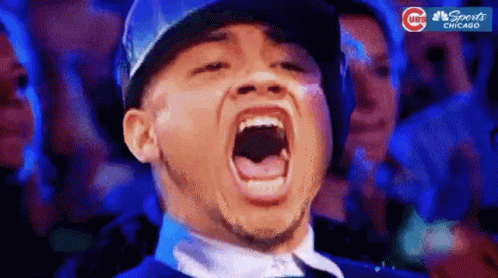 Man In Baseball Cap Screaming In Crowd GIF