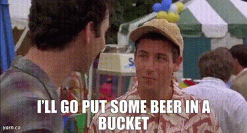 Man in Baseball Cap Talking to Another at Carnival