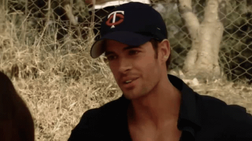 Man in Baseball Cap With Letter T