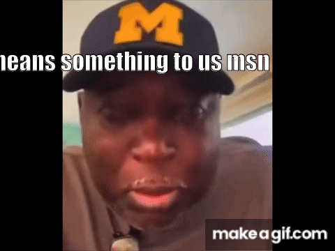 Man in Baseball Cap With M Making Funny Face