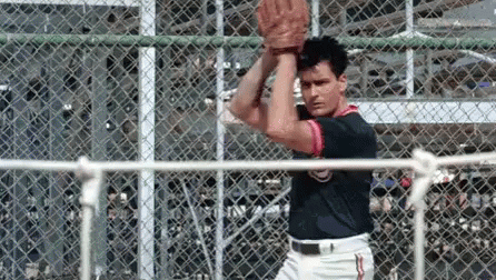 Man In Baseball Uniform Holding Baseball GIF