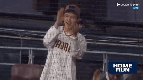 Man in Baseball Uniform Watching Game Home Run