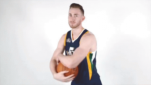 Man in Basketball Jersey Number 5 Holding Basketball