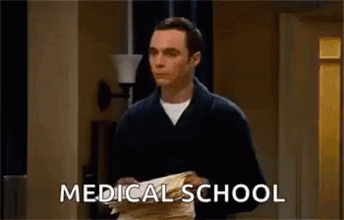Man in Bathrobe Holding Papers Medical School