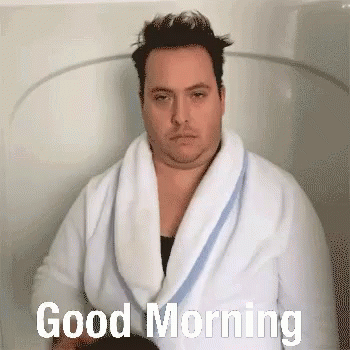Man in Bathrobe Saying Good Morning in Bathtub