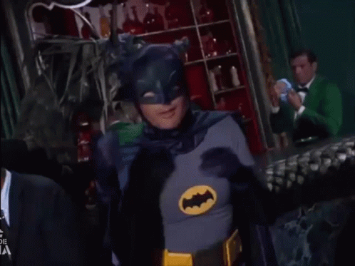 Man In Batman Costume Making Heart With Hands GIF