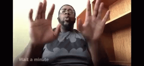 Man in Batman Shirt and Glasses Making Funny Face