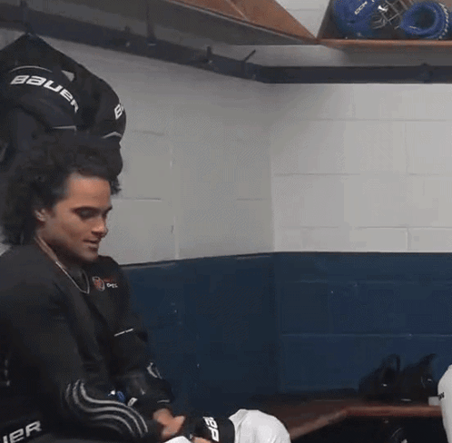 Man in Bauer Jersey in Locker Room