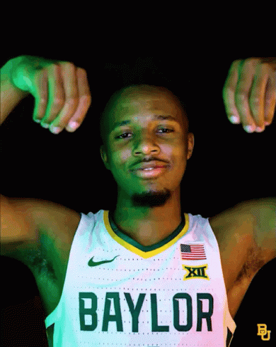 Man in Baylor Jersey Flexing Muscles