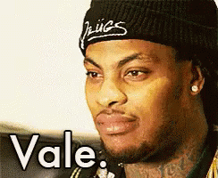 Man in Beanie and Bandana Saying Vale