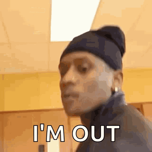 Man in Beanie and Jacket Making Funny Face Saying I'm Out