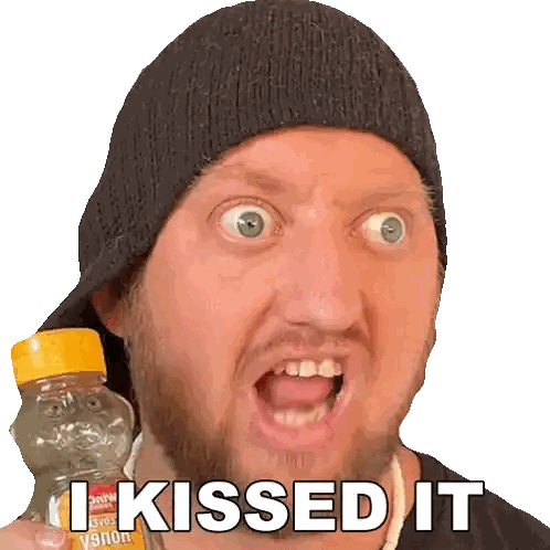 Man in Beanie Holding I Kissed It Bottle